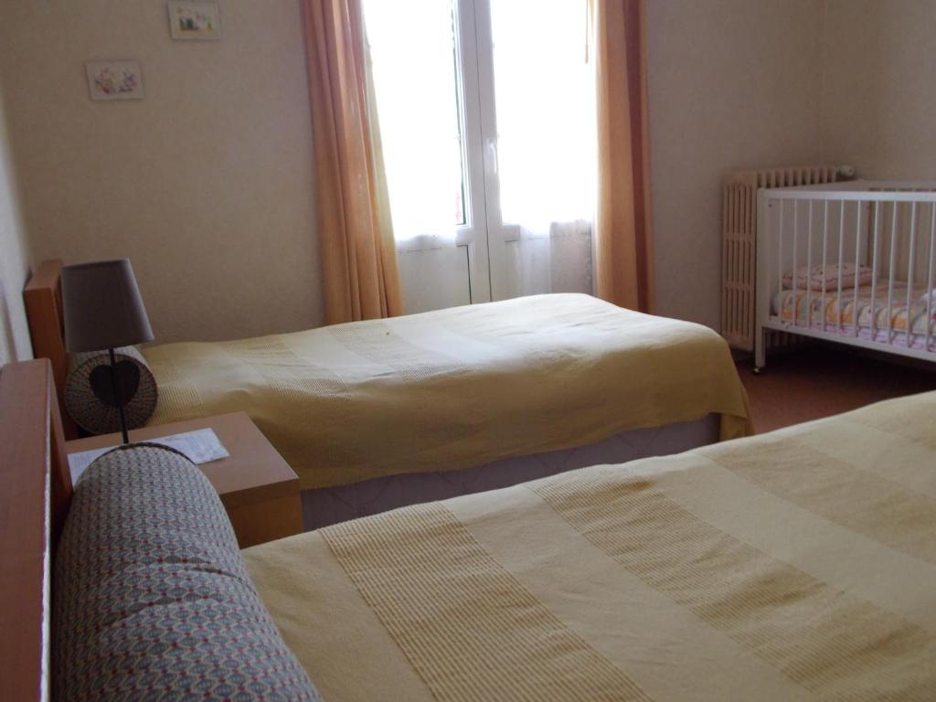 Postel nebo postele na pokoji v ubytování Le Soleil D'or