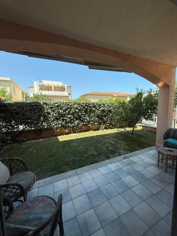 a patio with a view of a yard at Casa Rita in Olbia