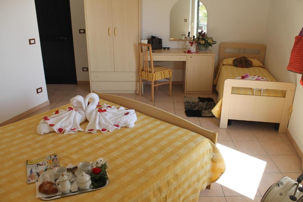 Postel nebo postele na pokoji v ubytování Hotel L'Ancora