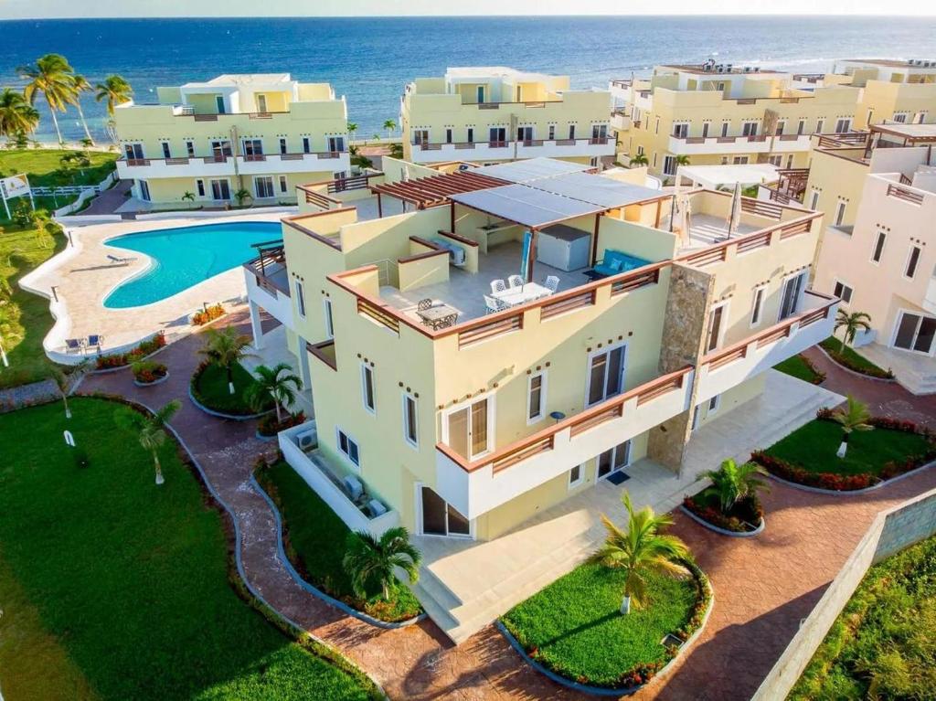 an aerial view of a villa with the ocean in the background at Las Palmas villa two bedrooms in Roatán