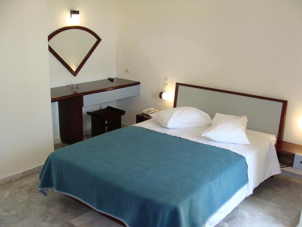 Postel nebo postele na pokoji v ubytování Rodon Hotel
