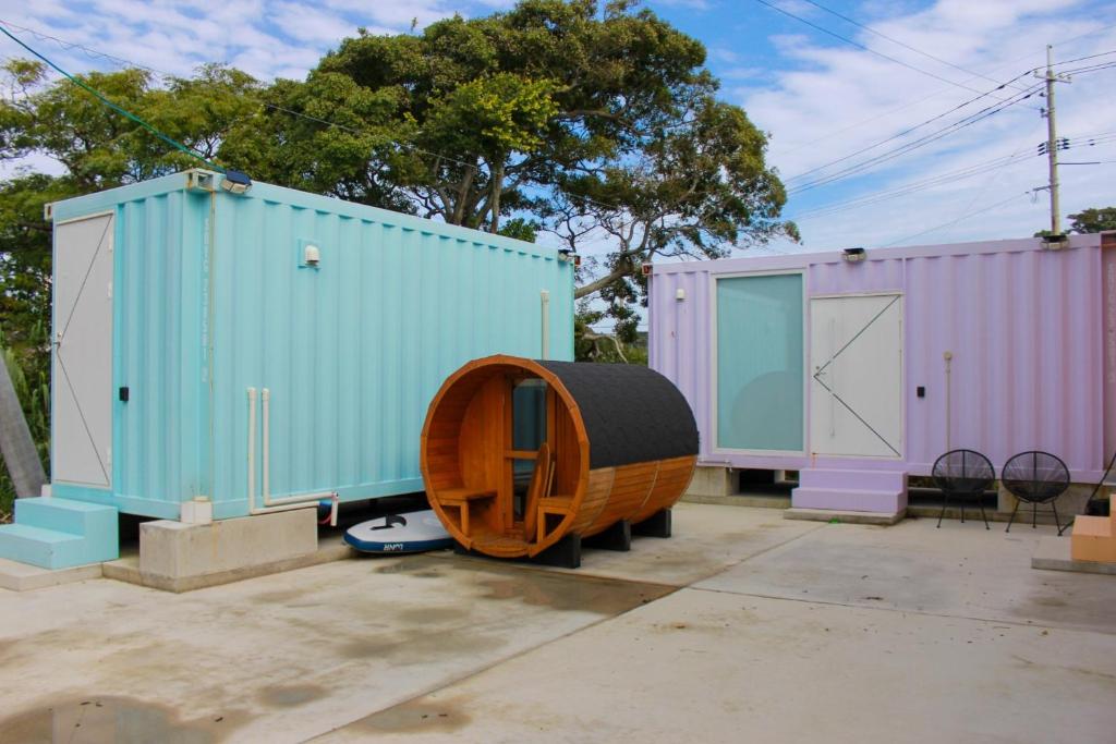 a group of three shipping containers with a wooden barrel at Villa Mikuri Tsunoshima - Vacation STAY 02209v in Shimonoseki