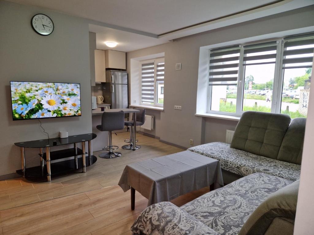TV a/nebo společenská místnost v ubytování Sporta 2-53