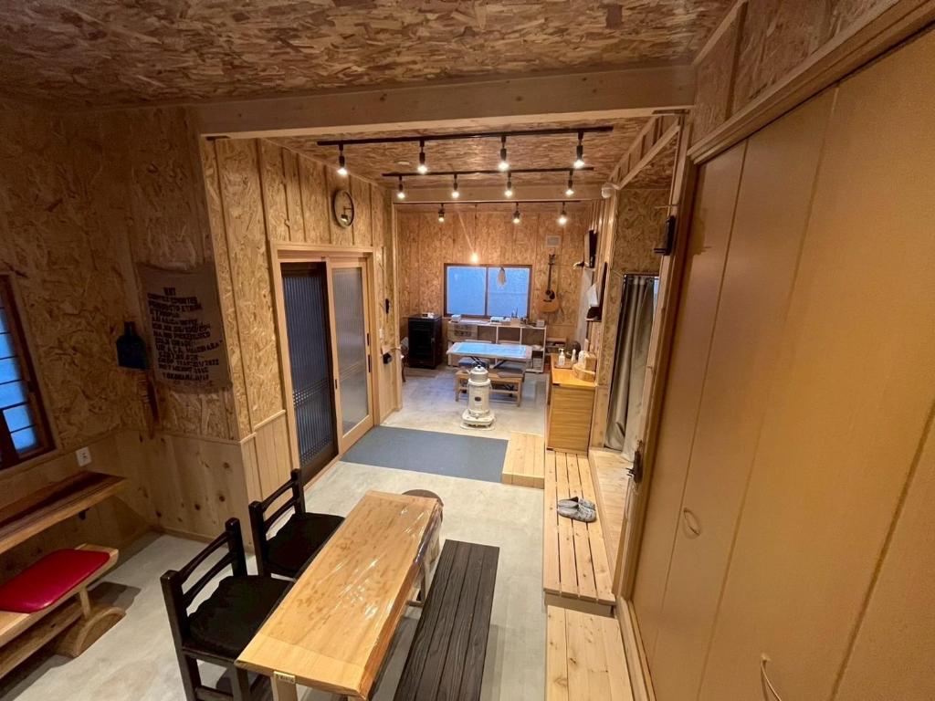 a room with a bench and a table in it at komorebi - Vacation STAY 19085 in Hakodate