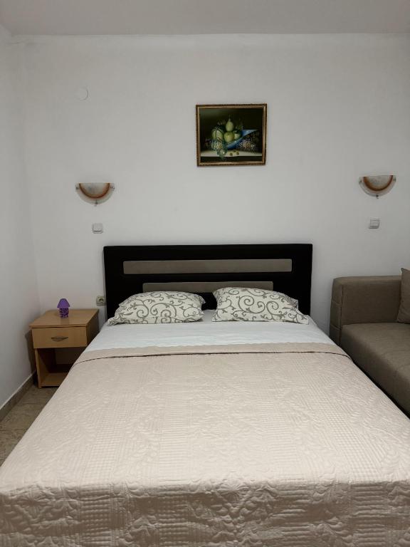 Postel nebo postele na pokoji v ubytování Studio Apartments Domenik