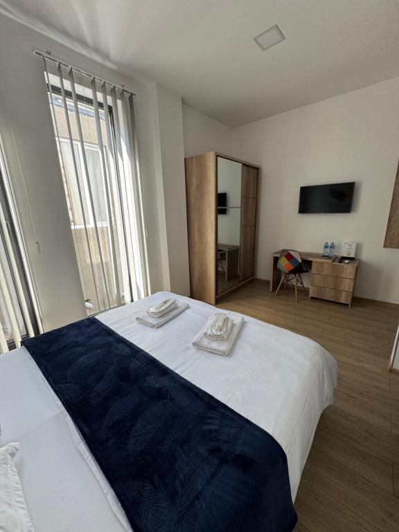 Postel nebo postele na pokoji v ubytování GH Prague Butik Hotel