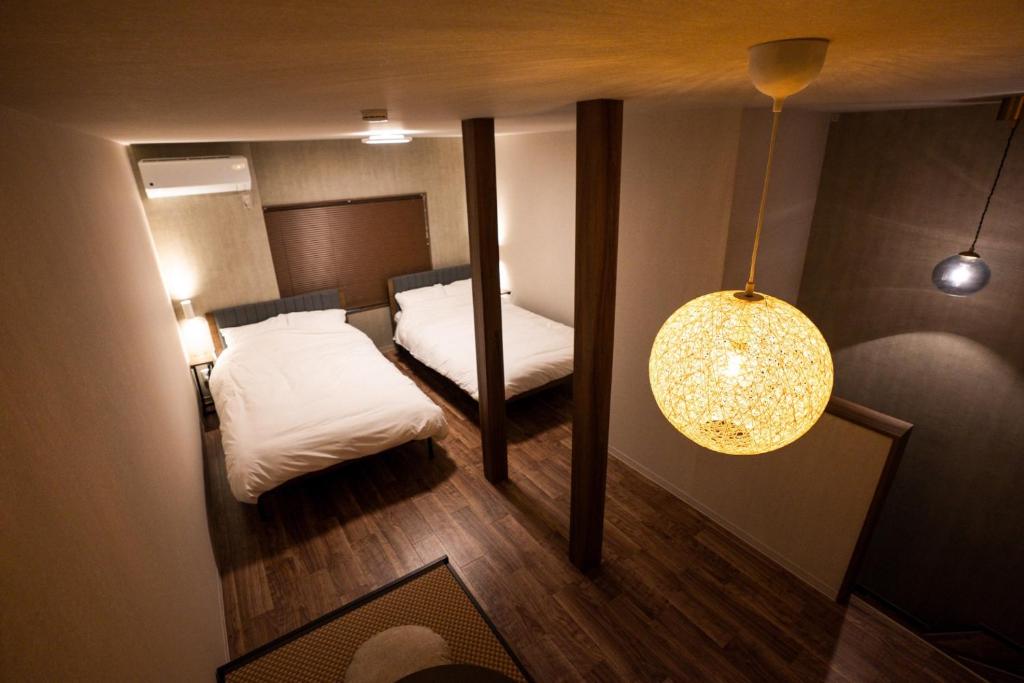 En eller flere senge i et værelse på Maison Yotsukuro - Vacation STAY 36360v