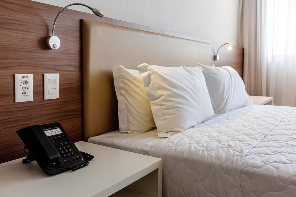 Postel nebo postele na pokoji v ubytování Rio Hotel by Bourbon Maringá