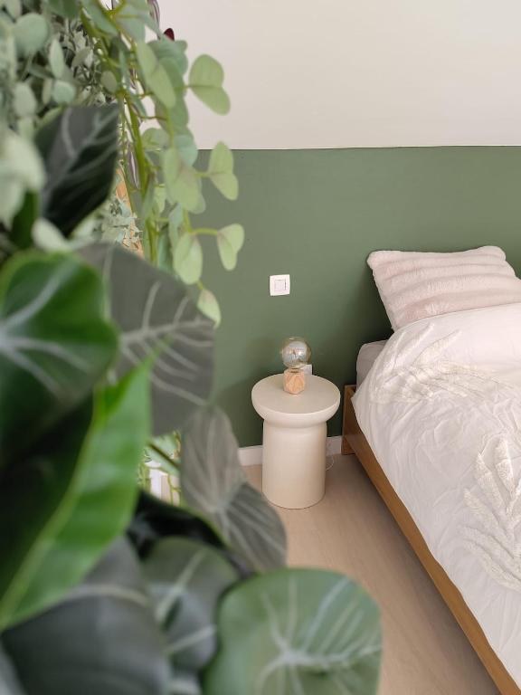 Postel nebo postele na pokoji v ubytování L'herbe Hôtes