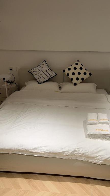 Ένα ή περισσότερα κρεβάτια σε δωμάτιο στο 马德里Usera民宿