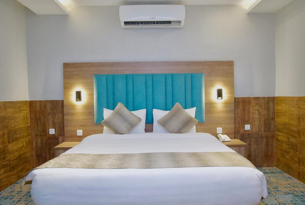 Postel nebo postele na pokoji v ubytování فندق ليوان ان Liwan Inn HOTEL