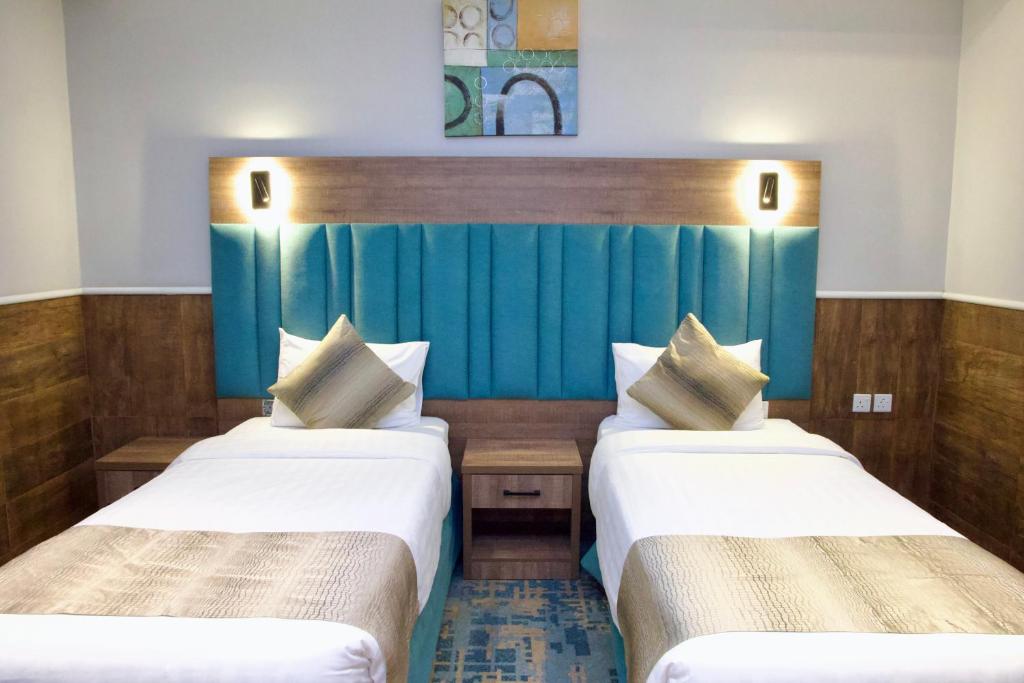 Postel nebo postele na pokoji v ubytování فندق ليوان ان Liwan Inn HOTEL