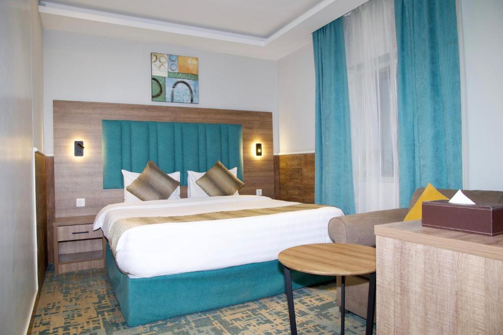 Postel nebo postele na pokoji v ubytování فندق ليوان ان Liwan Inn HOTEL