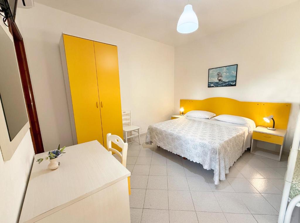 Uma cama ou camas num quarto em Hotel Villa Mena