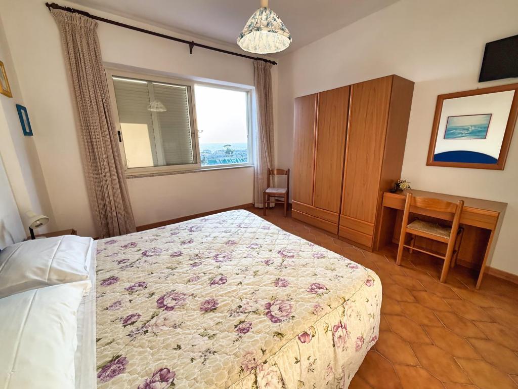 Uma cama ou camas num quarto em Hotel Villa Mena