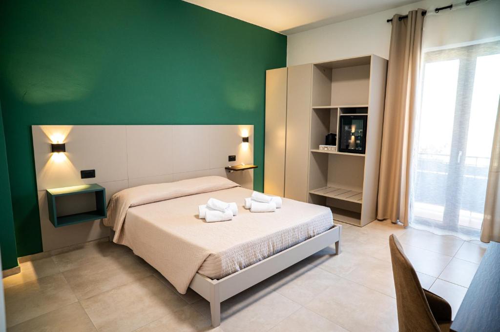 Postel nebo postele na pokoji v ubytování Flamengo rooms