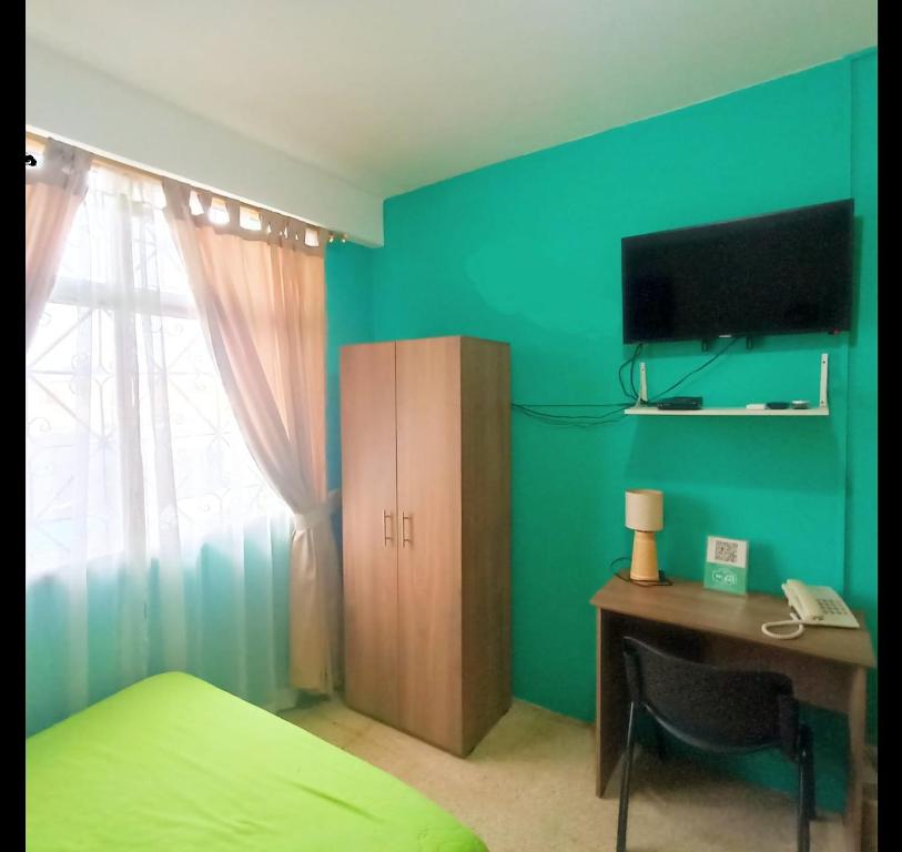 Postel nebo postele na pokoji v ubytování North Star Hostal Guayaquil