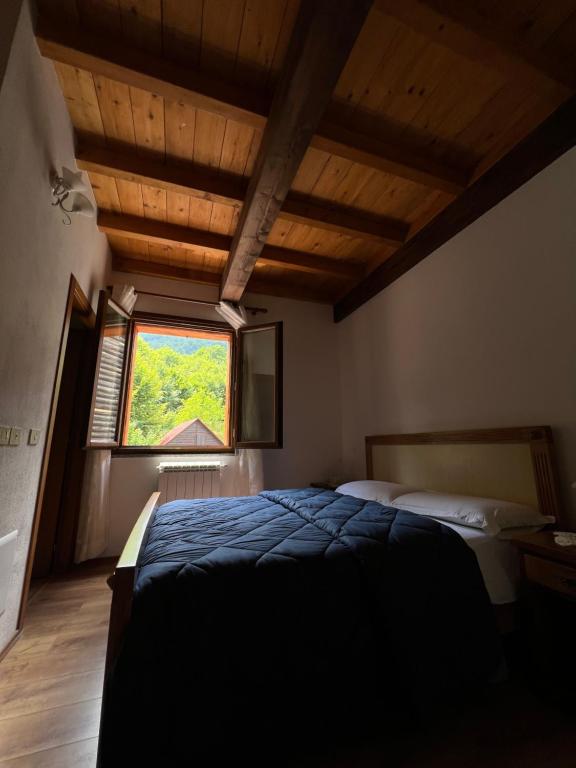 Postel nebo postele na pokoji v ubytování Villa Molla