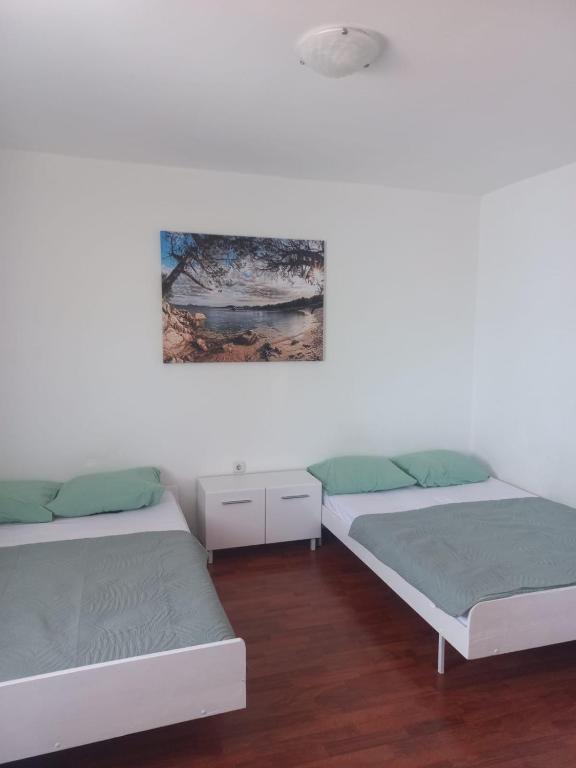 Postel nebo postele na pokoji v ubytování ApartmaniNET