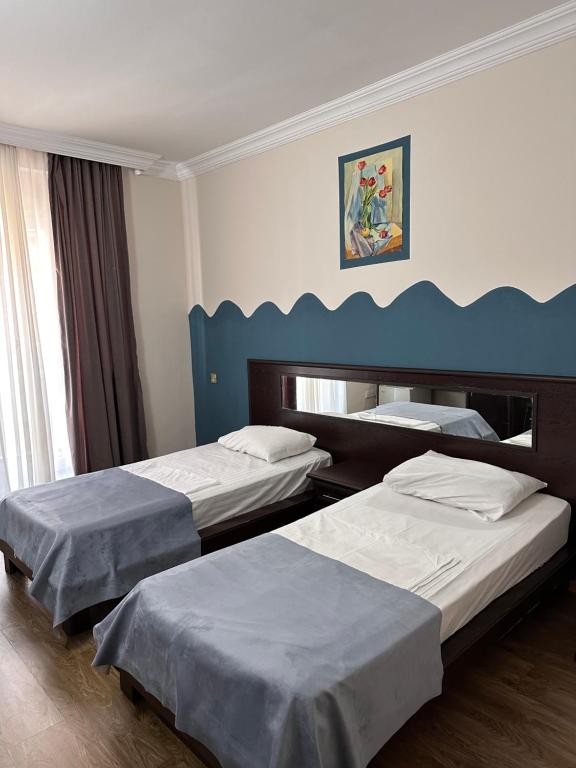 Postel nebo postele na pokoji v ubytování Hotel VISTA BATUMI