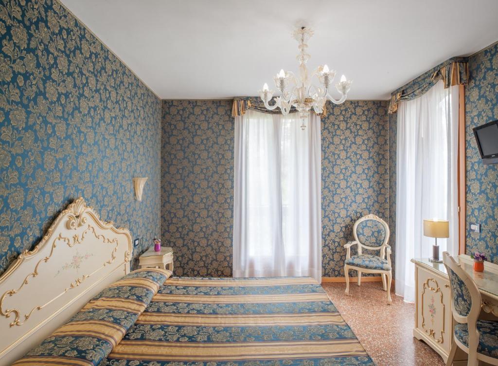 Postel nebo postele na pokoji v ubytování Hotel Il Mercante di Venezia