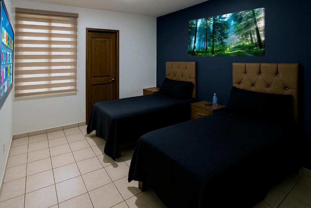 Postel nebo postele na pokoji v ubytování Casa Cómoda con Jacuzzi, Cochera, Terraza y Jardín