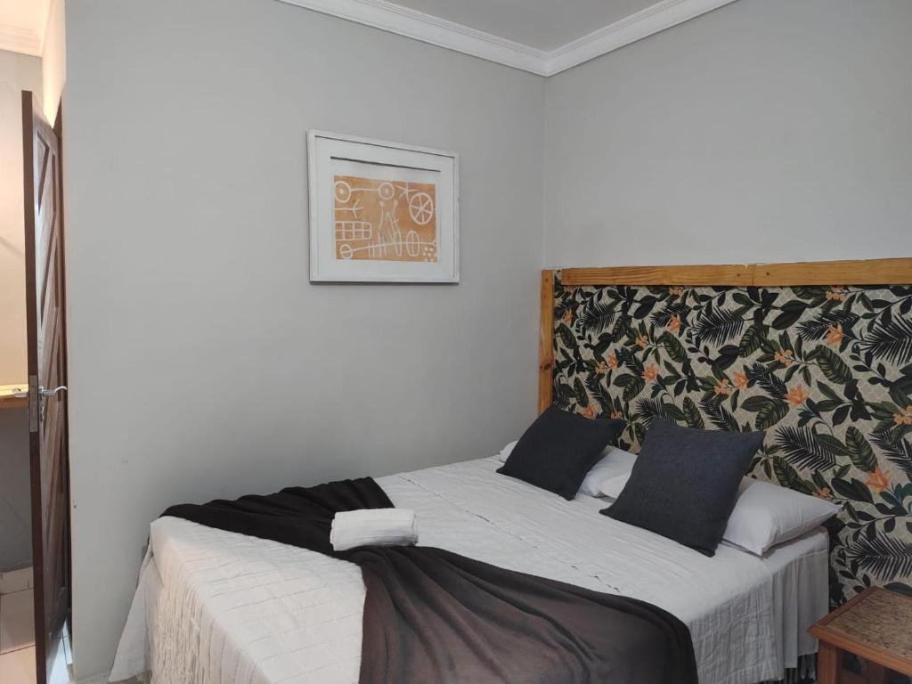 Cama ou camas em um quarto em Pousada Genipabu Praia