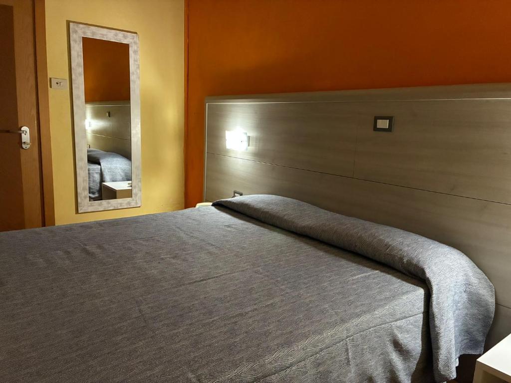 Postel nebo postele na pokoji v ubytování Hotel Annunziata