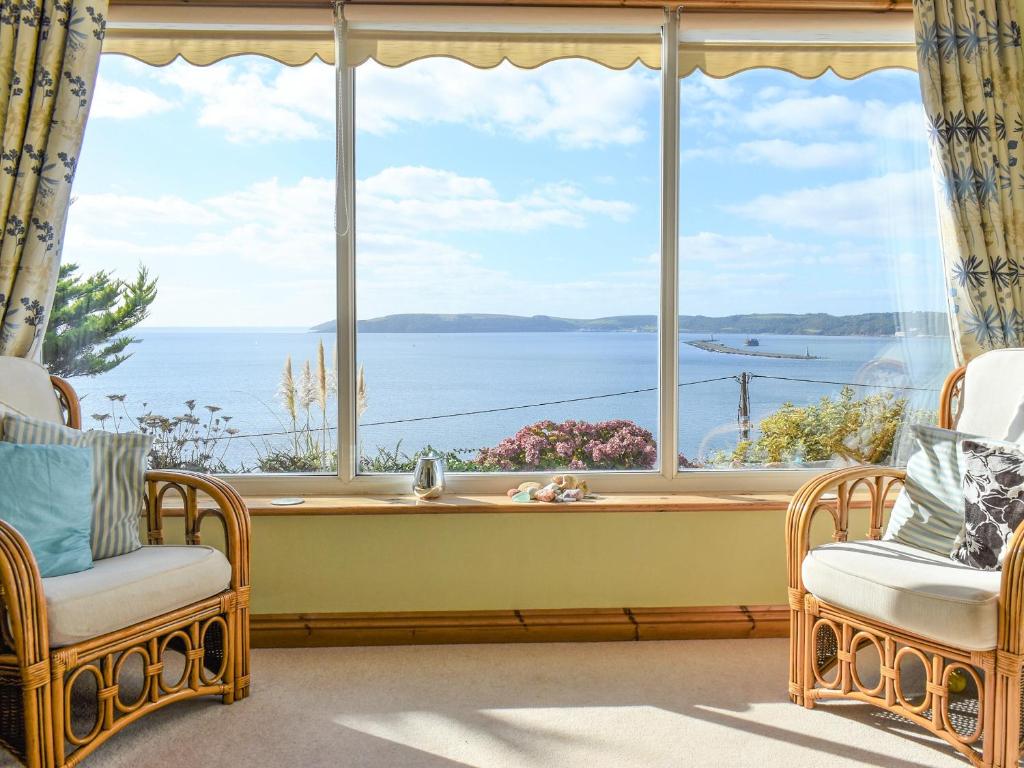 a large window with a view of the water at Sea Cottage in Turnchapel