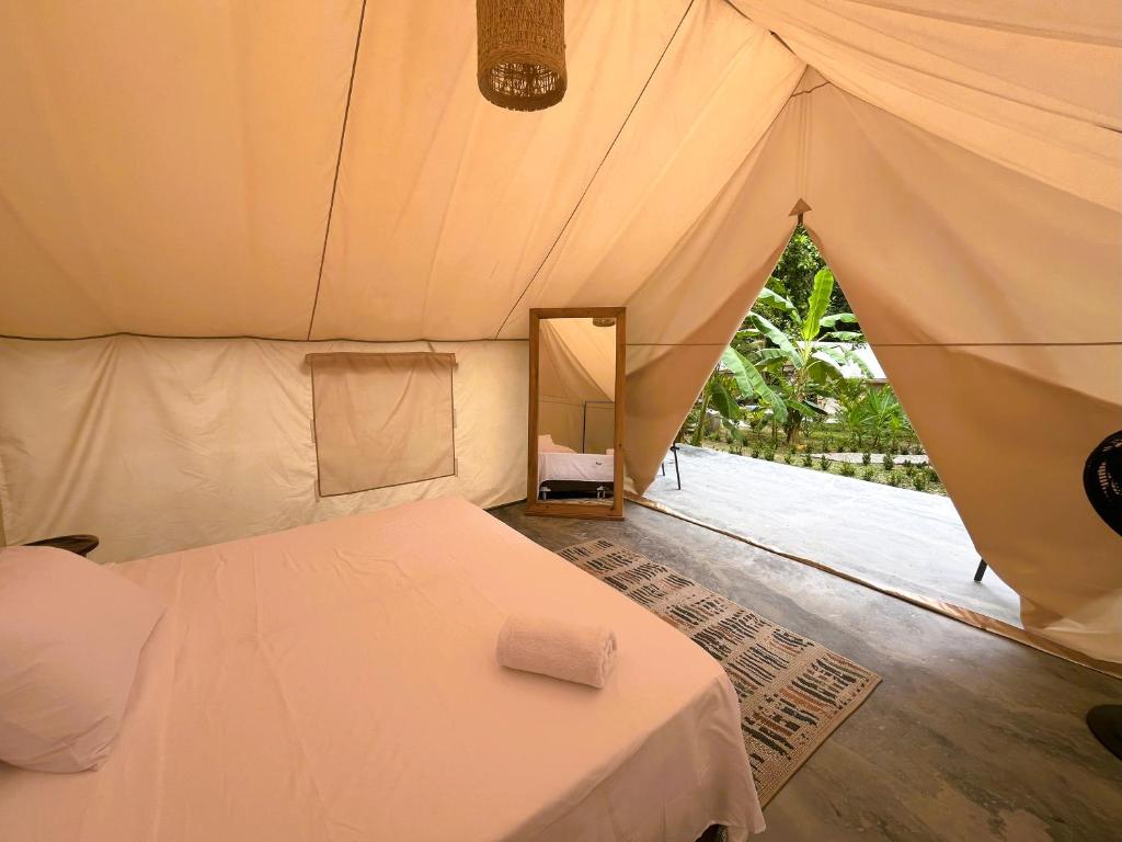 Postel nebo postele na pokoji v ubytování Glamping Jazayma Dentro del Parque Tayrona