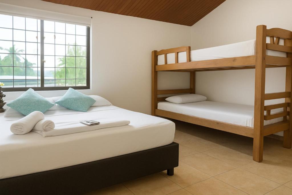 Postel nebo postele na pokoji v ubytování Mucho lo Bueno - Hostel House