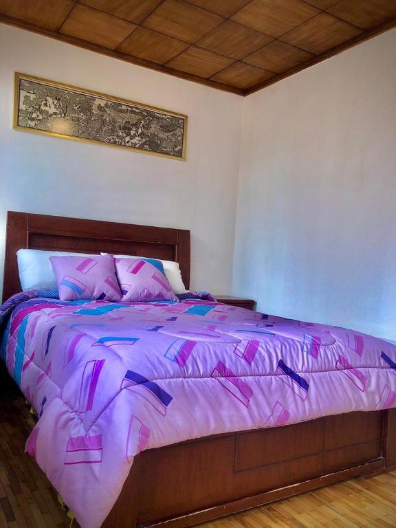 Postel nebo postele na pokoji v ubytování Hostal Café Tiana