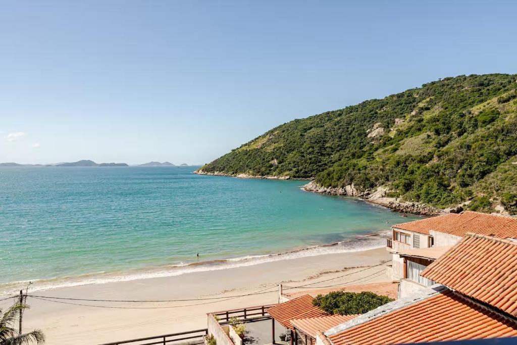 a view of the beach from a house at Beira-Mar Guest House in Arraial do Cabo