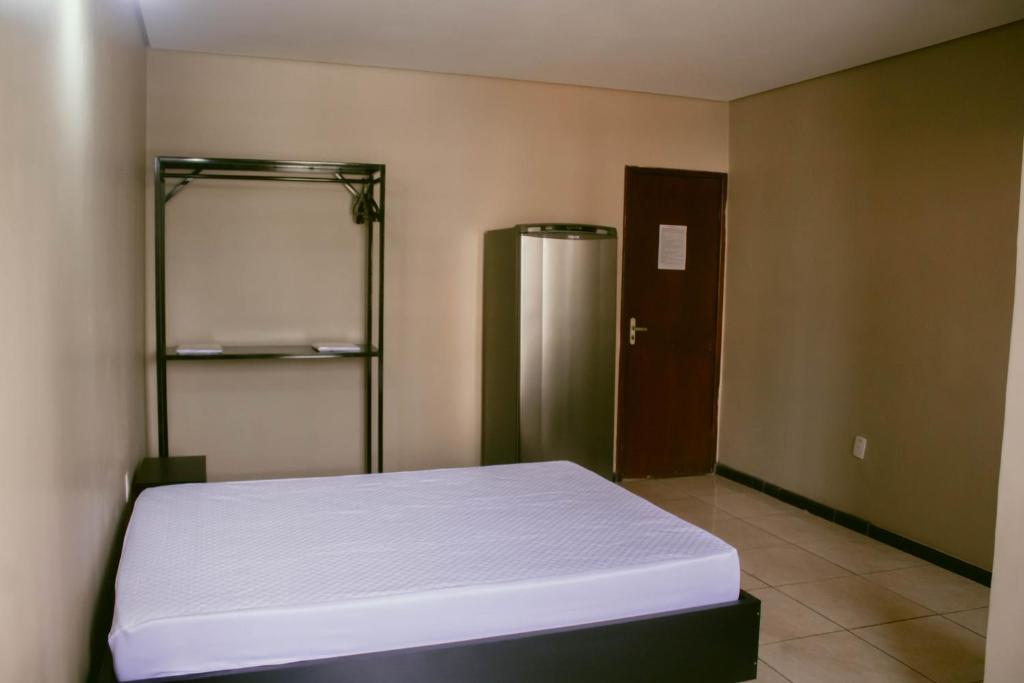 Postel nebo postele na pokoji v ubytování kitnet no centro de Betim