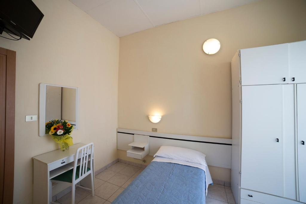 Postel nebo postele na pokoji v ubytování Hotel Europa