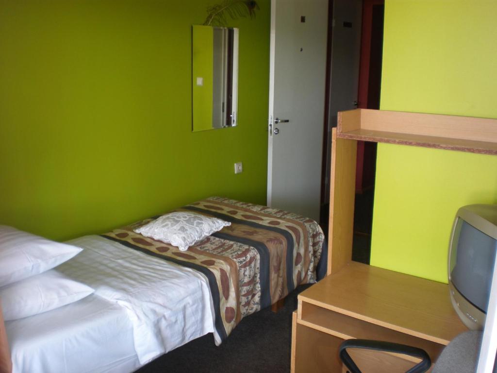 Postel nebo postele na pokoji v ubytování Hotel Getliin