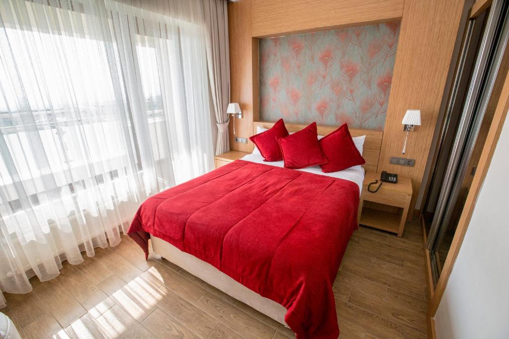 Postel nebo postele na pokoji v ubytování Hattusa Vacation Thermal Club Erzin