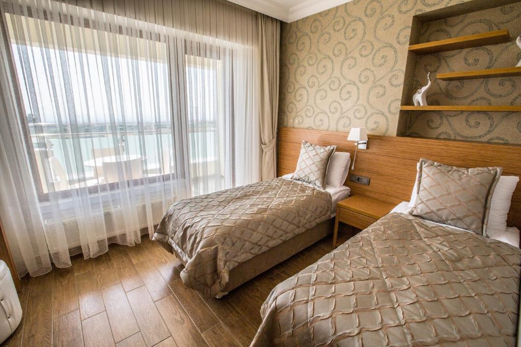 Postel nebo postele na pokoji v ubytování Hattusa Vacation Thermal Club Erzin