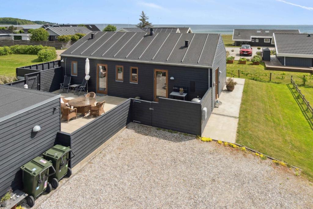 an aerial view of a black tiny house at Beautiful Home In As Vig, 100 M From The Beach in Sønderby