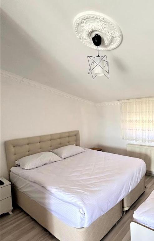 Postel nebo postele na pokoji v ubytování Gumus Hotel