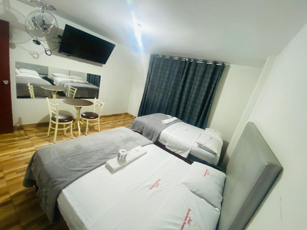 Postel nebo postele na pokoji v ubytování Hotel Peruvians House