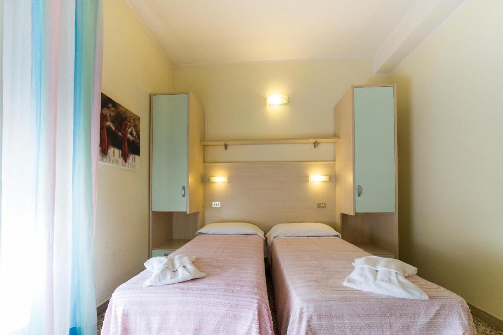 Postel nebo postele na pokoji v ubytování Hotel Europa