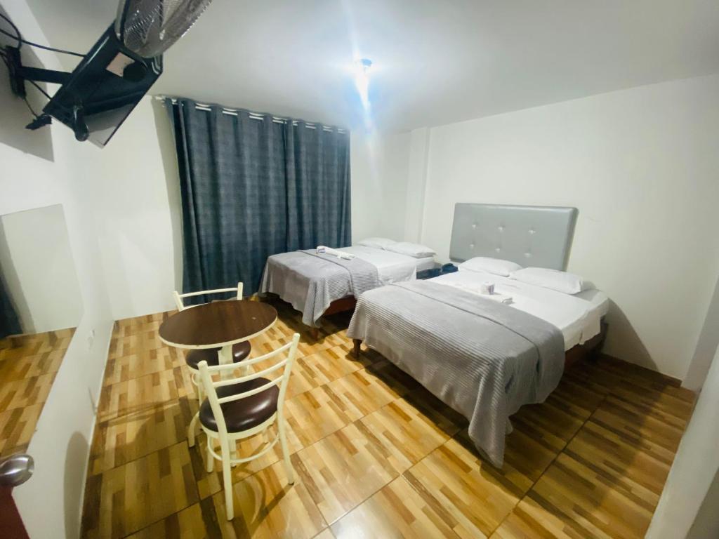 Postel nebo postele na pokoji v ubytování Hotel Peruvians House