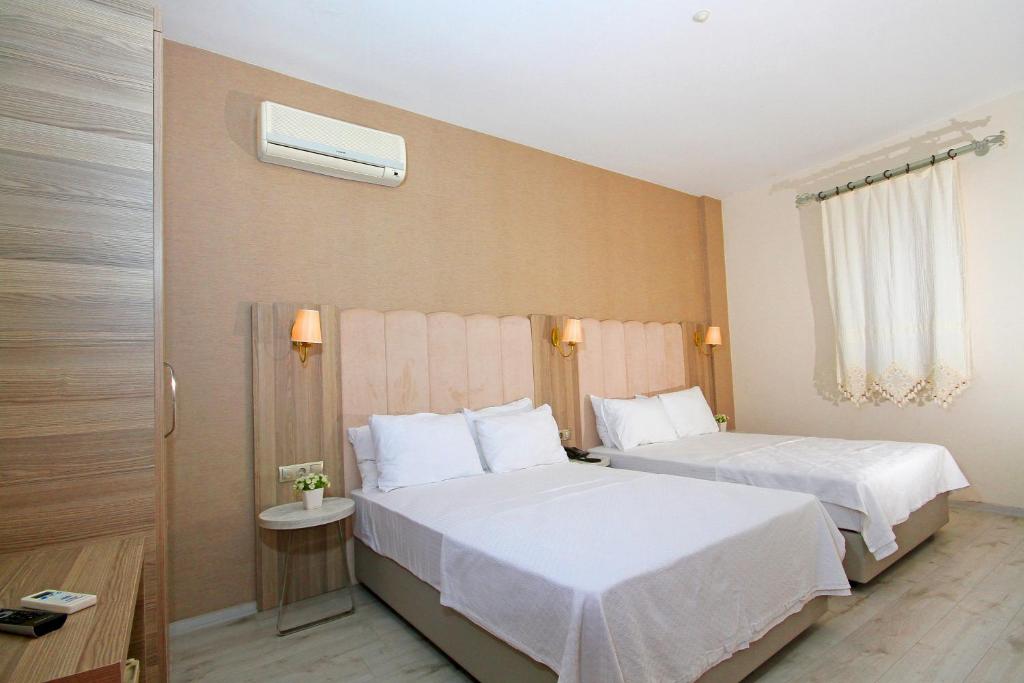 En eller flere senge i et værelse på Casa Alloro Bodrum