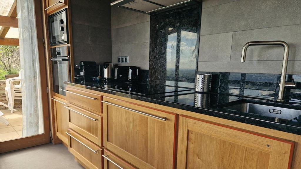 Kuchyň nebo kuchyňský kout v ubytování Chalet "Quelle Vue"