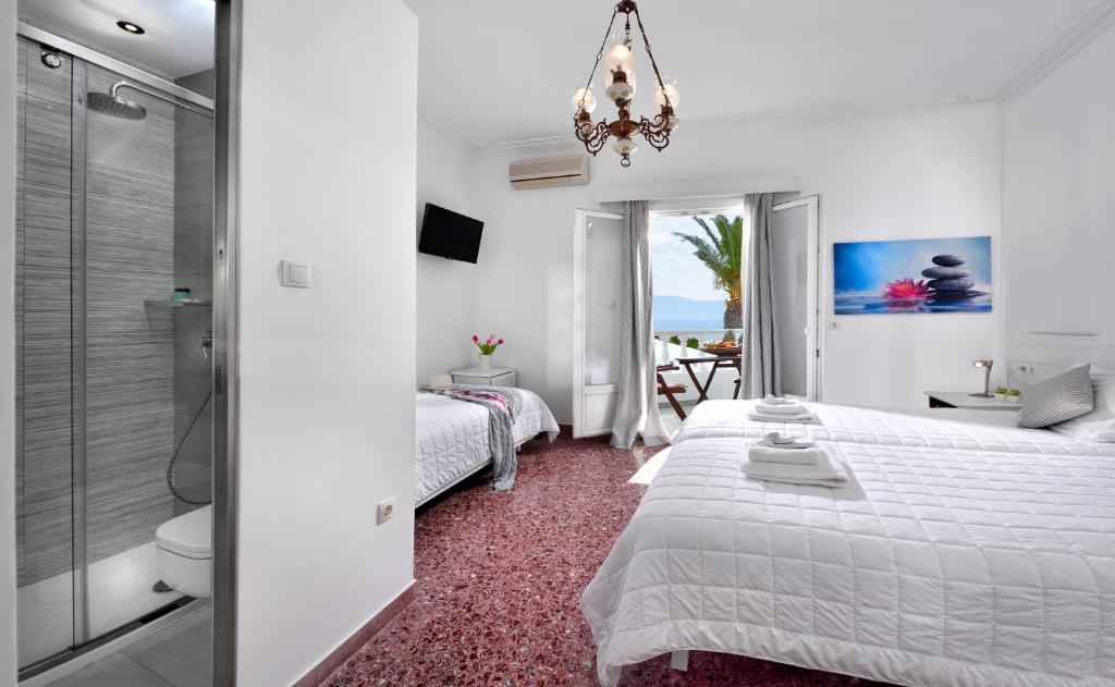 Postel nebo postele na pokoji v ubytování Hotel Nazos 1
