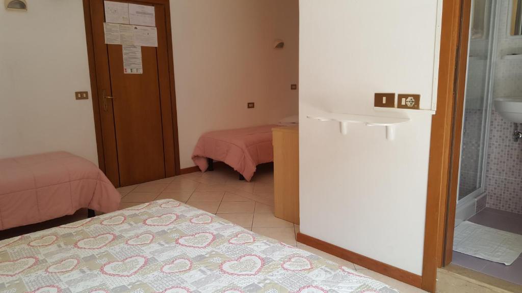 Postel nebo postele na pokoji v ubytování Hotel Canova