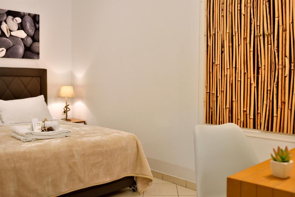 Postel nebo postele na pokoji v ubytování Hotel Nazos 1