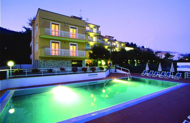 a large swimming pool in front of a building at Residence i Morelli in Pietra Ligure