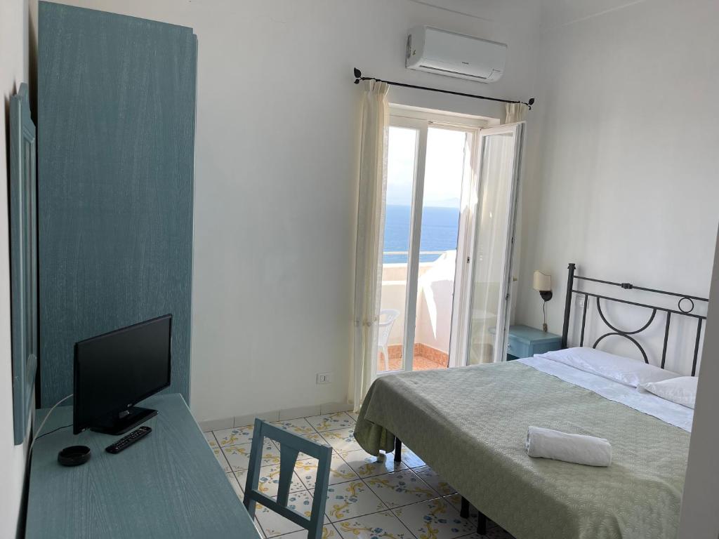 Postel nebo postele na pokoji v ubytování Hotel Residence - Parco Mare Monte